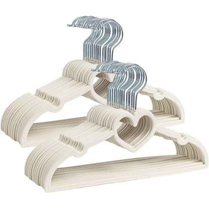 Set of beige kids velvet hangers with blue hooks on a white background