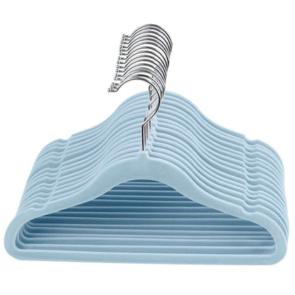 Set of light blue kids velvet hangers with a chrome hook on a white background