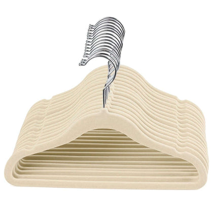 Beige kids velvet hangers with chrome hooks on a white background
