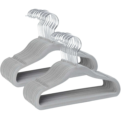 Set of gray kids velvet hangers with clear hooks on a white background