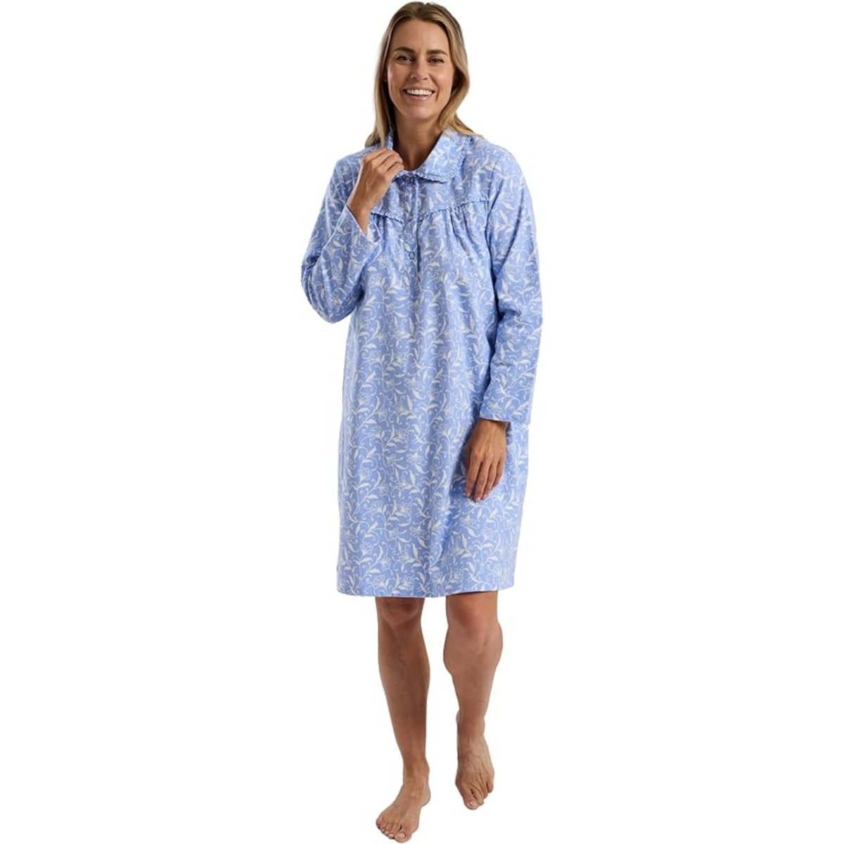 Woman wearing a blue patterned nightshirt on a white background