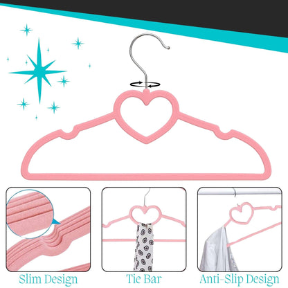 Pink kids velvet hanger with heart design, showing features like slim design, tie bar, and anti-slip design on a white background.