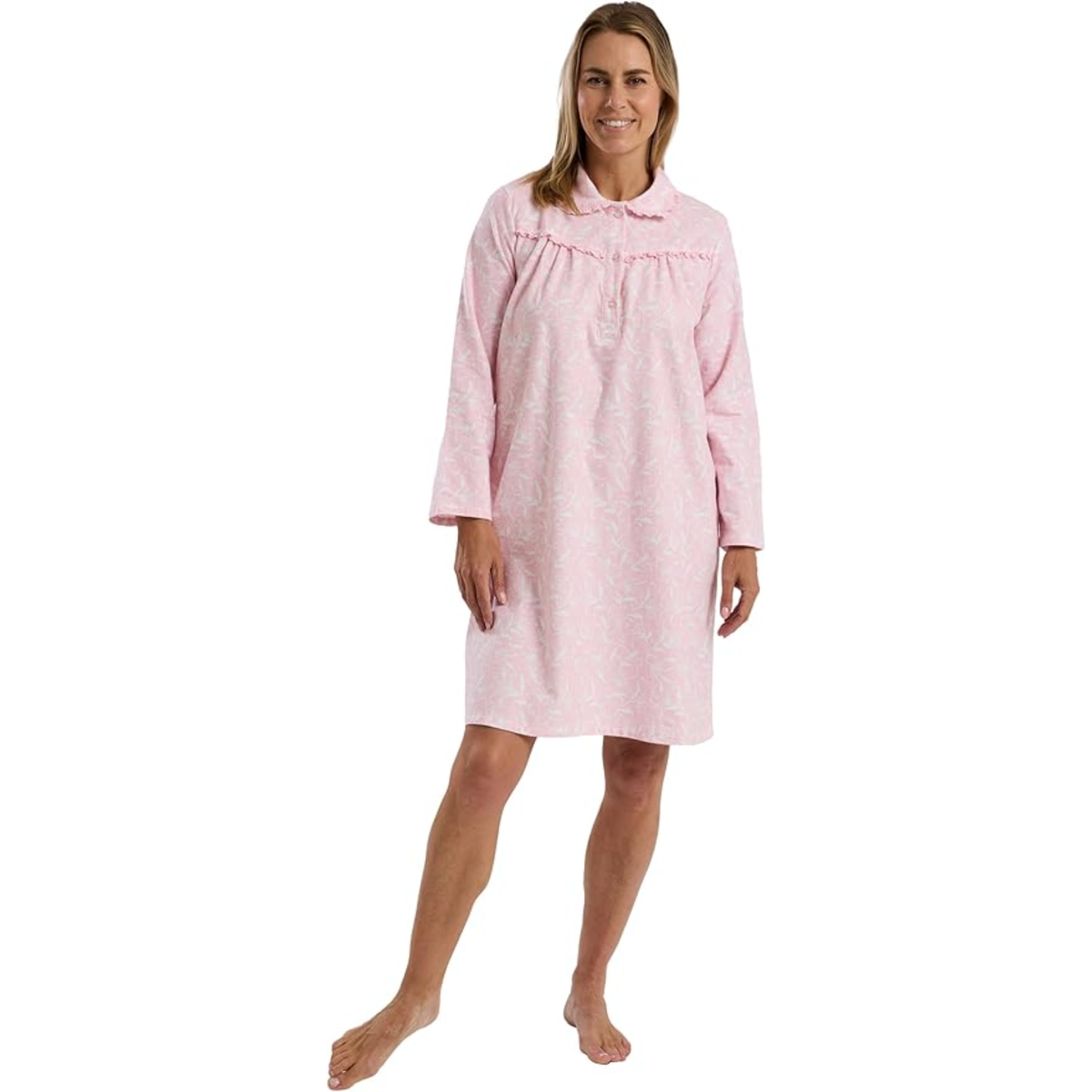 Woman wearing a pink nightshirt on a white background
