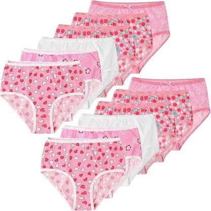 Set of pink girls' underwear with heart patterns on a white background